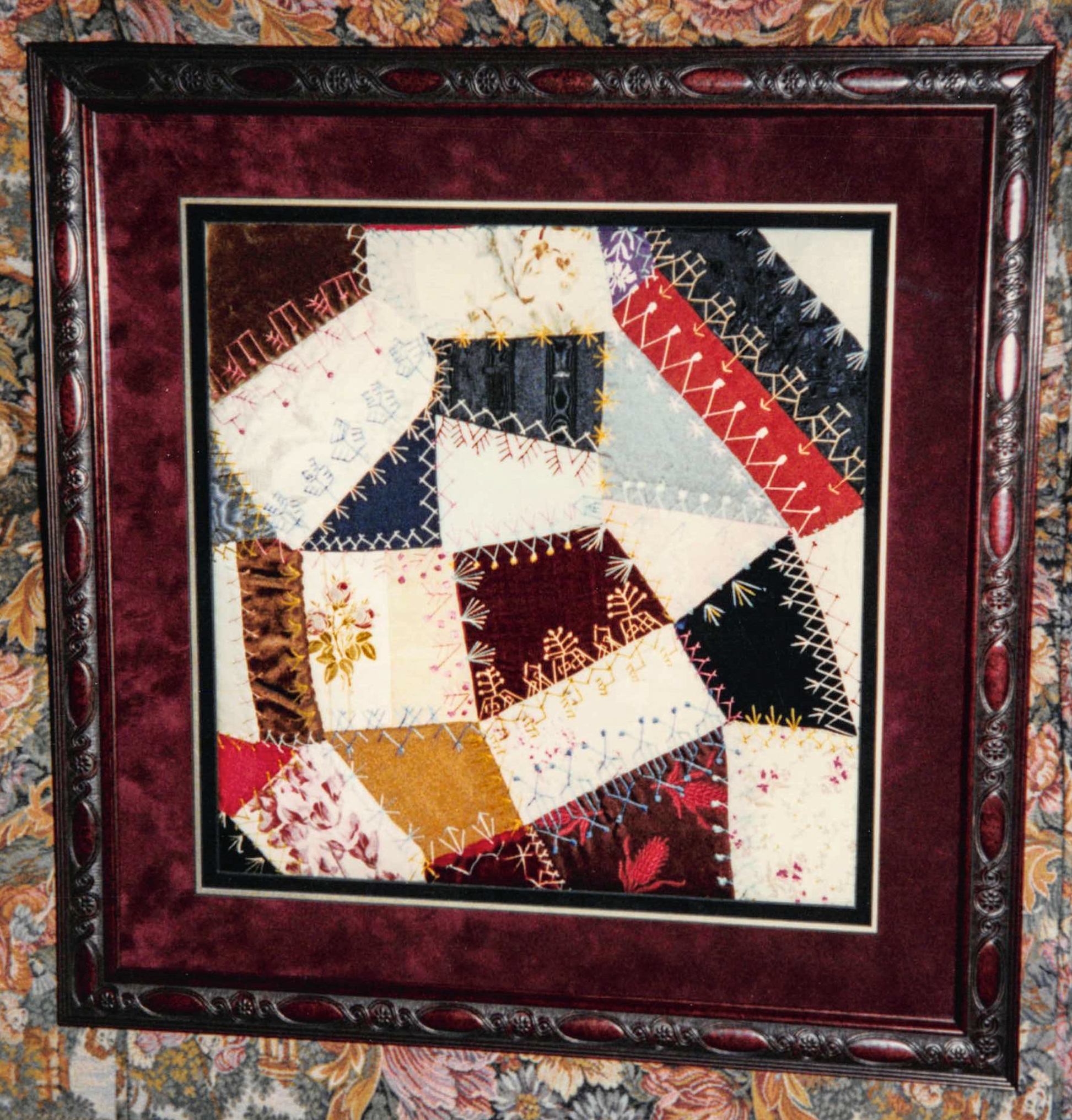 Framed portion of vintage embroidered Crazy quilt